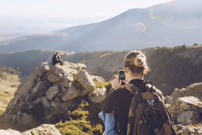 Rear view of woman looking at mountains