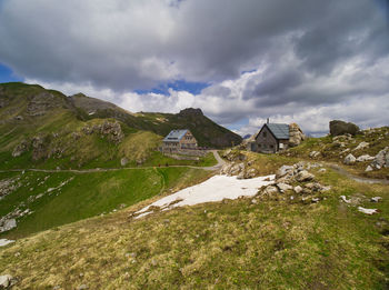 Scenic view of landscape and mountains against sky