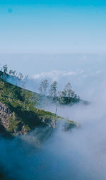 Scenic view of waterfall against sky