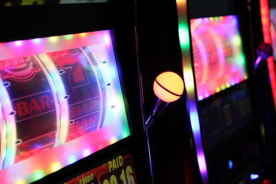 Close-up of illuminated multi colored glass at night