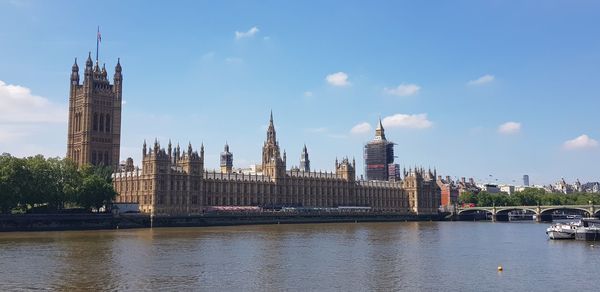 Houses of parliament and river thames viewed from the south bank  in london, uk