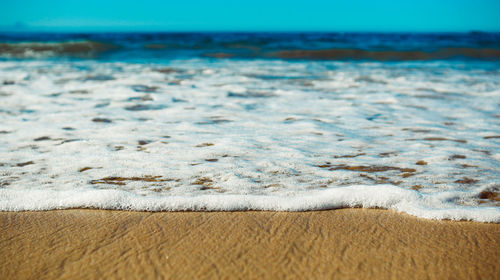 Surface level of beach against sky