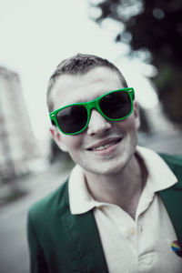 Portrait of smiling man wearing sunglasses