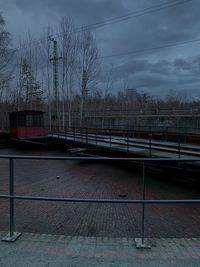 Bridge over canal against sky