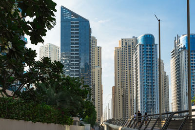 Dubai marina in the uae. modern buildings in city against sky