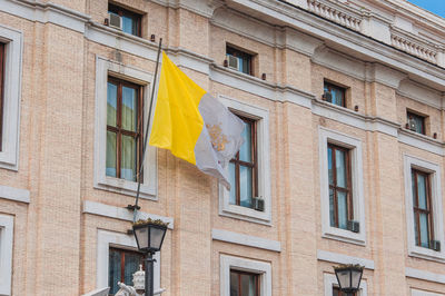 Low angle view of clothes drying on building