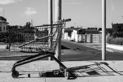 Abandoned shopping cart on sidewalk