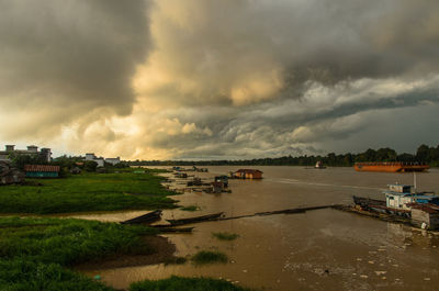 Scenic view of sea against storm clouds