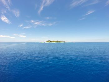 Scenic view of sea against blue sky