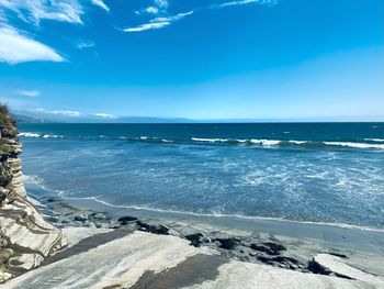 Scenic view of sea against blue sky