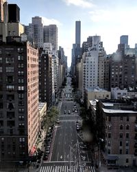 High angle view of buildings in city against sky