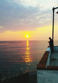 Scenic view of sea at sunset