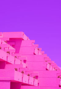 Minimalist building hotel and sky background. purple and pink colours trends. 
