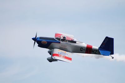 Low angle view of airplane flying against clear sky