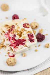 High angle view of cheesecake served in plate on table