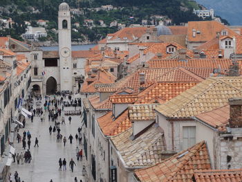 High angle view of people walking along built structures