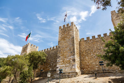 Low angle view of são jorge castle  against sky