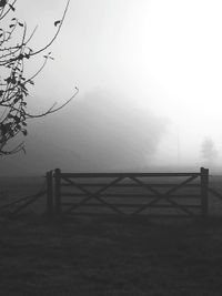 Scenic view of landscape against sky during foggy weather