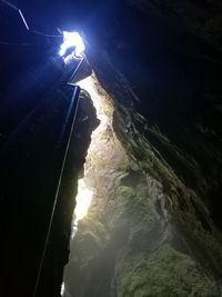 Low angle view of illuminated mountain against sky