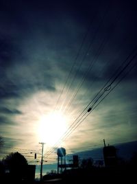 Low angle view of electricity pylon against sky
