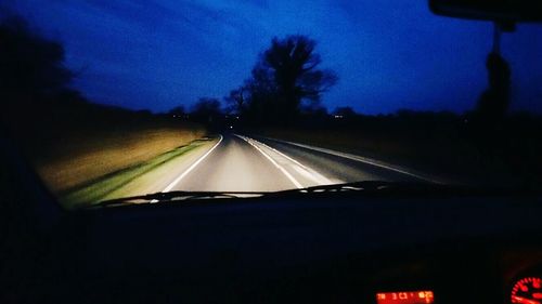 Road seen through car windshield