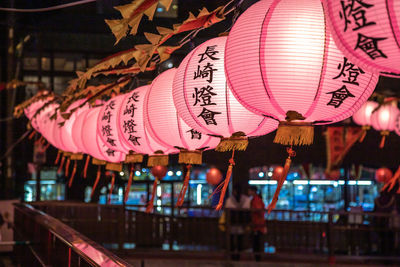 Illuminated lanterns hanging at night