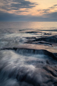 Scenic view of sea against sky during sunset