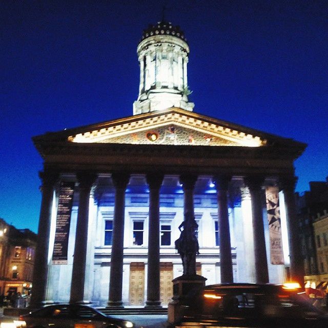 architecture, low angle view, built structure, building exterior, famous place, travel destinations, blue, statue, religion, sculpture, human representation, place of worship, travel, tourism, clear sky, sky, spirituality, history, art and craft, architectural column