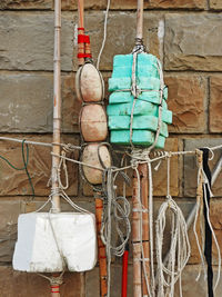 Clothes hanging on rope against wall