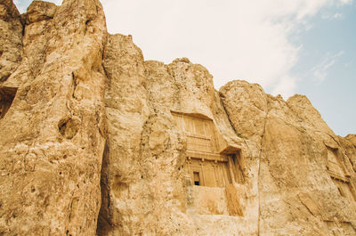 Low angle view of rock formation against sky