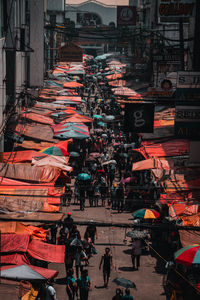 People on street market in city