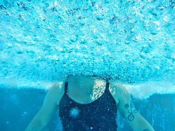Woman swimming in pool