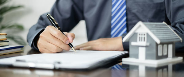 Midsection of man working at office