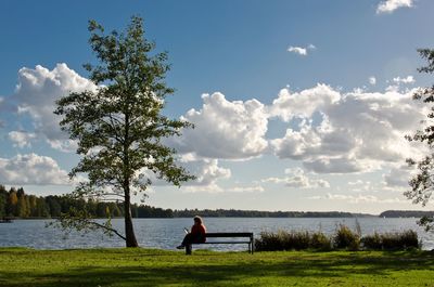 Scenic view of lake against cloudy sky