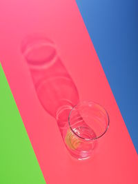 Close-up of drink in glass against blue background