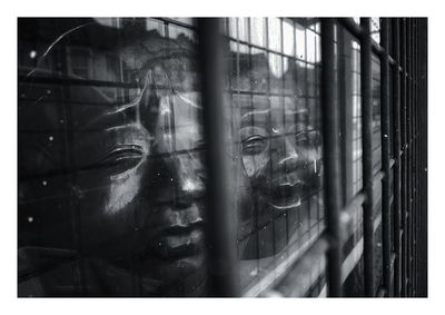 Reflection of building on glass window