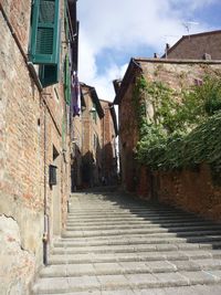 Footpath amidst buildings in town