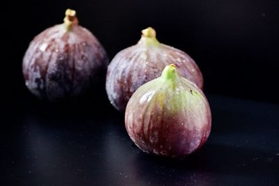 Close-up of fruits against black background