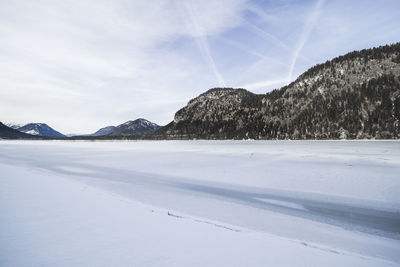 Scenic view of landscape against sky during winter