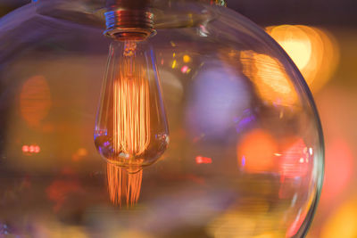 Close-up of light bulb in glass globe