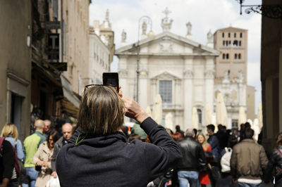 Rear view of people photographing