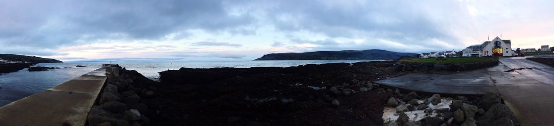 Panoramic view of sea against storm clouds