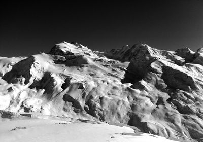 Scenic view of snow covered mountains