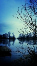 Scenic view of calm lake against sky