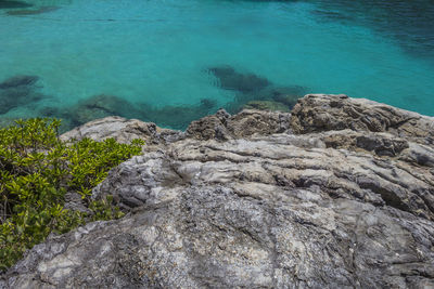 High angle view of rocks by sea