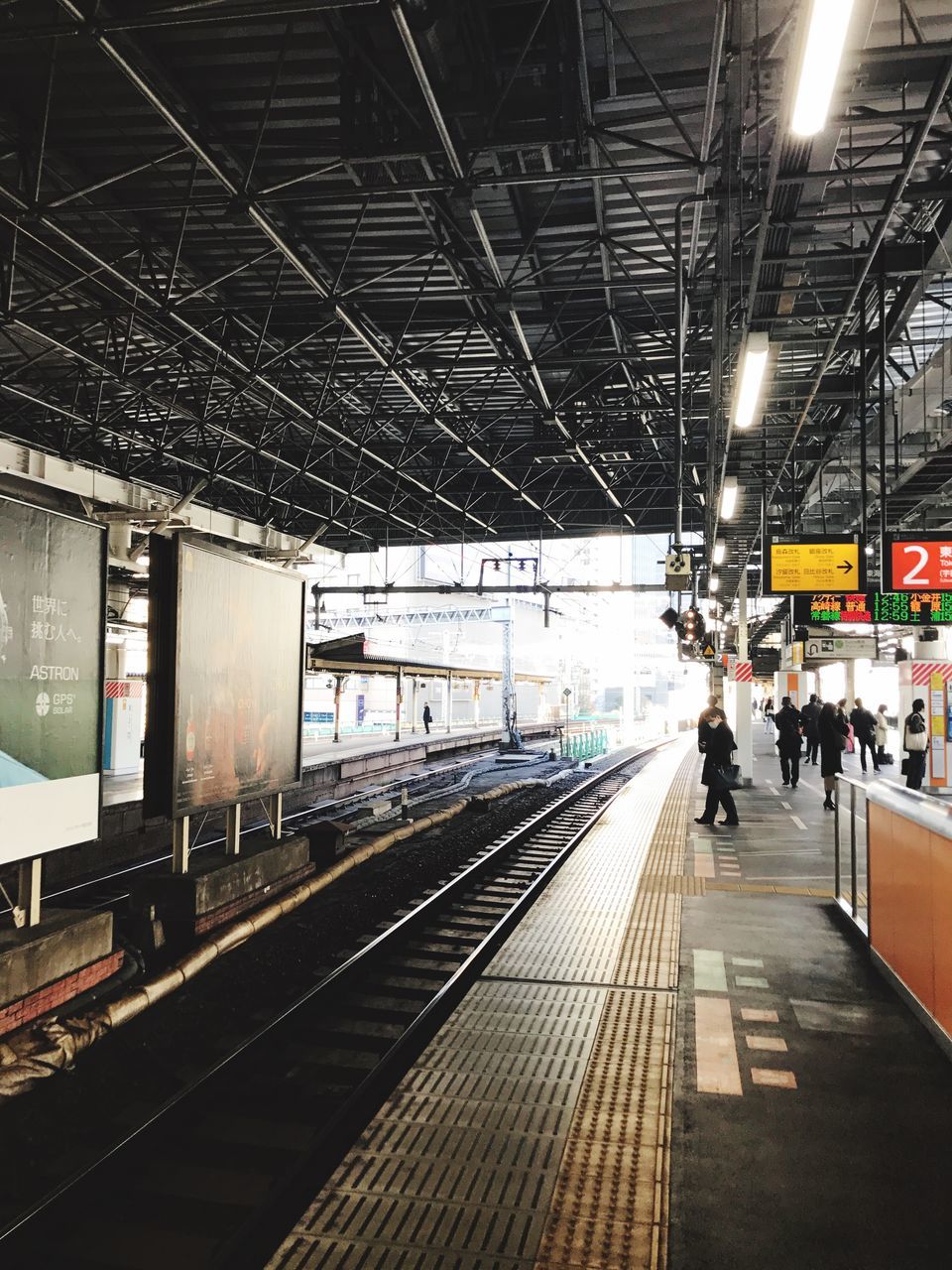 transportation, railroad station, railroad station platform, railroad track, travel, rail transportation, public transportation, mode of transport, train - vehicle, indoors, day, large group of people, clock, sky, people