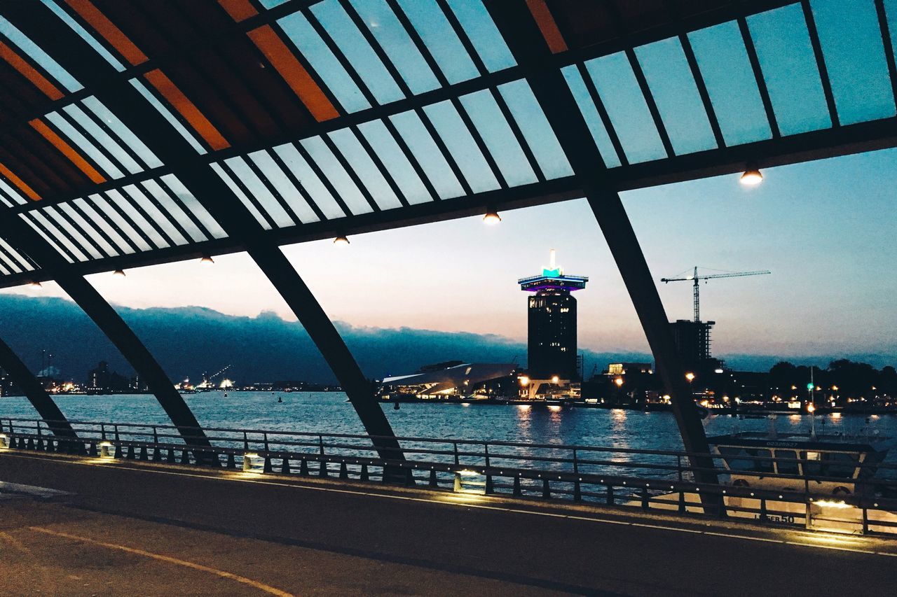 built structure, transportation, architecture, sky, bridge - man made structure, illuminated, engineering, water, city, mode of transport, building exterior, connection, dusk, travel, sea, railing, travel destinations, metal, outdoors, no people