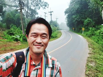 Portrait of man on road