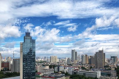 Modern buildings in city against sky