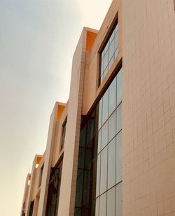 Low angle view of office building against sky